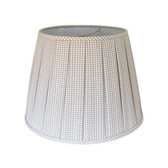 a lampshade with a white and brown checkerboard pattern on the bottom