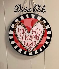 a sign hanging on the side of a door that says divine skills for god to solve the world