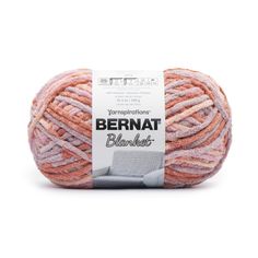 bernat blanketed yarn in pink and orange colors on a white background with the label