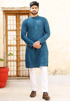 Readymade Faux Georgette Kurta in Teal BlueThis Chinese Collar and Full Sleeves attire is Enhanced with Pockets, Resham and Sequins WorkDo note: Bottom and Footwear shown in the image is for presentation purposes only. Half to one inch may vary in measurement. (Slight variation in actual color vs. image is possible)  We sell all kinds of menswear. Mens Kurta | Mens Kurta Pajama | Mens Sherwani | Mens Sherwani Sets | Traditional Menswear | Partywear Menswear | Indian Mens Dresses | Diwali Kurta | Blue Traditional Wear With Dabka For Ceremonies, Blue Kurta With Zari Work For Traditional Ceremonies, Traditional Royal Blue Kurta With Dabka, Transitional Blue Kurta For Traditional Ceremonies, Blue Kurta For Eid And Traditional Ceremonies, Blue Traditional Wear With Intricate Embroidery For Ceremonies, Traditional Royal Blue Dabka Kurta, Blue Traditional Wear For Eid Ceremonies, Blue Sets With Resham Embroidery For Traditional Ceremonies