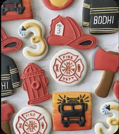 decorated cookies with fire and rescue symbols on them