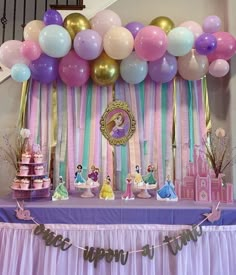 a birthday party with princess decorations and balloons