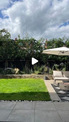 an outdoor patio with lawn furniture and white umbrellas on it's side walk