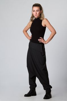 "Harem Pants Women, Black Pants, Drop Crotch Pants This is one of my favorite women's extravagant boho trousers - super comfy drop-crotch lose cut wide-leg tapered at the bottom maxi harem pants. I adore those loose, casual long pants! Handmade from 100% high-quality, excellent cool wool, these pants are an excellent winter, spring, and fall clothing option. KEY FEATURES: - Drop crotch, super loose - Tapered legs - Hidden zipper closure at the hip - Custom size and plus size available at NO EXTR Stretch Harem Pants For Festivals, Bohemian Black Pants, Fitted Harem Bottoms For Festival, Black Wide Leg Bottoms For Festival, Stretch Hippie Harem Bottoms, Wide Leg Black Bottoms For Festival, Hippie Stretch Harem Bottoms, Fitted Hippie Harem Bottoms, Hippie Fitted Harem Bottoms