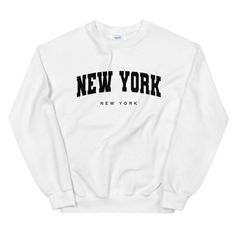 NYC Varsity Crewneck Sweatshirt | NYC Sweatshirt | Vintage NYC Crewneck Sweater | New York City Sweatshirt | Unisex Sweatshirt A sturdy and warm sweatshirt bound to keep you warm in the colder months. A pre-shrunk, classic fit sweater that's made with air-jet spun yarn for a soft feel and reduced pilling. * 50% cotton, 50% polyester * Pre-shrunk * Classic fit with no center crease * 1x1 athletic rib knit collar with spandex * Air-jet spun yarn with a soft feel and reduced pilling * Double-needle Retro Nyc, Nyc Sweatshirt, Varsity Crewneck, City Sweatshirt, New York Sweatshirt, Vintage Nyc, Sweatshirt Vintage, Sweaters Crewneck, Fitted Sweater