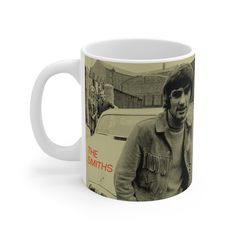 the smiths coffee mug with an image of a man standing in front of a car