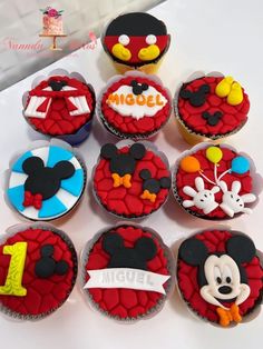 mickey mouse cupcakes are decorated with fondant