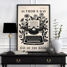 a black and white poster with an old fashioned typewriter on it's side table