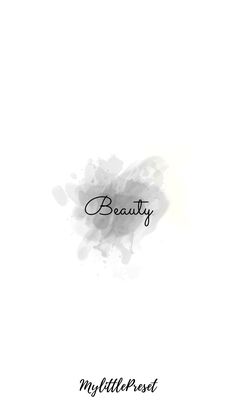 the word beauty written in black ink on a white background with watercolor stains and smudges