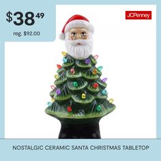 a ceramic christmas tree with santa's hat on it for $ 38 99 reg $ 92 00