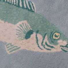 a fish rug is shown on the floor