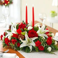 Christmas and NewYears Arrangement Christmas Arrangement International Delivery Next-Day Delivery to outside the US and Canada by a local florist is available on international orders if placed by 2p.m. Eastern Time and as allowed by the delivery date selection calendar. Delivery Details Substitution Policy Substitutions may be necessary to ensure your arrangement or specialty gift is delivered in a timely manner and depending on availability. The utmost care and attention is given to your order to ensure that it is as similar as possible to the requested item. Substitution Policy ITEM: # 4219TRS Light Centerpieces, Lush Christmas, Floral Crafts, Table Flower Arrangements, Festive Centerpieces, Christmas Candle Decorations, Christmas Table Centerpieces