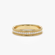 a yellow gold wedding band with white diamonds