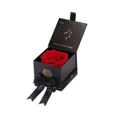 a black box with a red rose in it