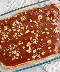 a glass baking dish filled with chocolate and nuts