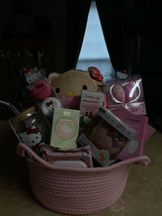 a pink basket filled with lots of stuff