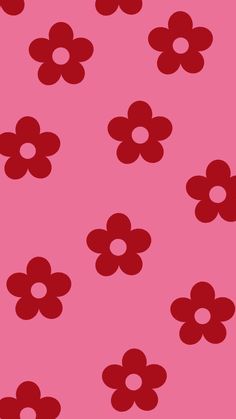 a pink background with red flowers on it