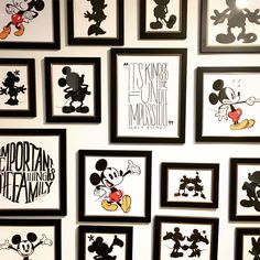 many framed mickey mouses are hanging on the wall