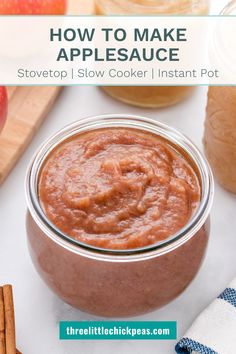 an apple sauce in a glass jar with cinnamon sticks