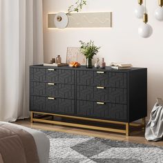 a black and gold dresser in a bedroom