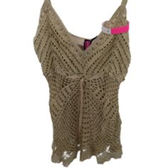 Say What? Fully Lined Crochet Tank With Adjustable Spaghetti Straps And Cute Tie Detail To Front. Size Large Length: 16” Back Chest: 14" Measurements Are Taken Laying Flat & Are Approximate Colors May Differ Slightly From Photos Based On The Device Used To View And Color Settings. Fast Shipper All Items Have An Inventory Tag Attached Which Ensures You're Getting The Item Pictured And Must Remain Attached For A Return 20949 Fitted Beige Crochet Top For Beachwear, Sleeveless Crochet Top For Party, Sleeveless Crochet Trim Top For Party, Sleeveless Crochet Top With Crochet Trim For Party, Fitted Lace Crochet Top For Beach Season, Beige Crochet Top For Summer Party, Crochet Lace Cami Top For Beach, Beige Stretch Crochet Lace Top, Crochet Lace Camisole Top For Beach