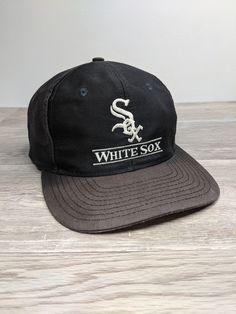 Vintage 90's Chicago White Sox Snapback Hat Cap. Has heavy fading and discoloring from age, headband has discoloring and other wear. NO holes... Ready To Wear One Size Fits Most. Vintage Cotton Baseball Cap With Letter Print, Casual Baseball Cap With Cotton Sweatband For Streetwear, Vintage Pre-washed Snapback Baseball Cap, Vintage Black Snapback Hat With Letter Print, Vintage Baseball Trucker Hat For Streetwear, Vintage Snapback Hat For Baseball Season Streetwear, Vintage Black Cotton Baseball Cap, Casual Cotton Baseball Cap Fan Merchandise, Vintage Black Baseball Cap For Sports Events