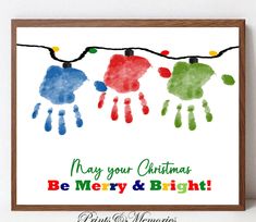 a christmas card with three handprints hanging from a string and the words may your christmas be merry and bright