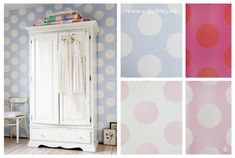 a white wardrobe with polka dot wallpaper next to a pink and blue painted wall