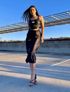 A midi skirt featuring a straight silhouette, knee length, and an elastic waist. Satin Midi Skirt, Knee Length, Midi Skirt, Elastic Waist, Satin, Elastic, Skirt