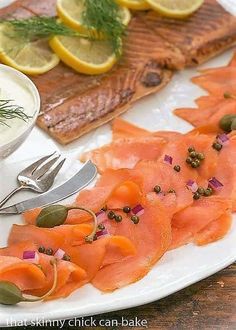 the plate is filled with smoked salmon and garnished with capers