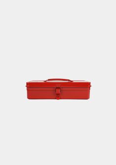 a red box with a handle on the top and two handles at the bottom, in front of a white background