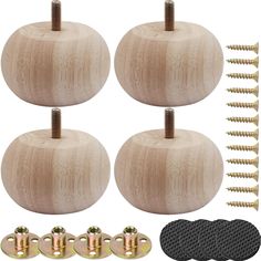 four wooden pumpkins with screws and nails on them, all in different sizes