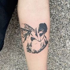 a person with a tattoo on their leg