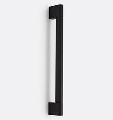 a black door handle on a white wall