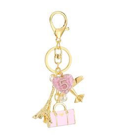 Our pink, gold and pearl charm keychain will look beautiful as an accent piece on your handbag or added to your keys. Includes delicate pearl detailing. This is a beautiful keychain to have or gift Size: 6" H x 1.5" W Logo Charm Keychains For Gifts, Gift Keychain With Logo Charm, Trendy Pink Bag Charm For Gift, Pink Jewelry With Logo Charm For Gifts, Bag Charm With Keys As Gift, Luxury Gold Bag Charm As Gift, Gold Keychain With Logo Charm As Gift, Trendy Pink Travel Keychain, Gold Logo Charm Bag Charm