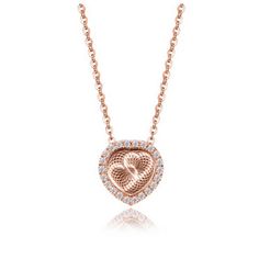 Elevate your elegance and celebrate love with the Heart Pendant Chain Necklace from the Ginger Lyne Collection. This necklace is a testament to romance and craftsmanship, perfect for women who appreciate beauty and meaningful jewelry. The heart-shaped pendant is adorned with clear cubic zirconia stones that sparkle with brilliance. As you move, the hearts within the pendant dance around, creating a captivating and mesmerizing effect. You have the choice of either Rose Gold over Sterling Silver o Cubic Zirconia Rose Gold Necklace For Anniversary, Elegant Rose Design Jewelry For Valentine's Day, Elegant Rose Design Necklace For Mother's Day, Rose Gold Heart Pendant Necklace For Formal Occasions, Elegant Flower Pendant Necklaces For Valentine's Day, Elegant Cubic Zirconia Necklace For Anniversary, Elegant Flower Pendant Necklace For Valentine's Day, Flower Pendant Necklace For Valentine's Day Anniversary, Elegant Diamond Cut Necklace For Mother's Day