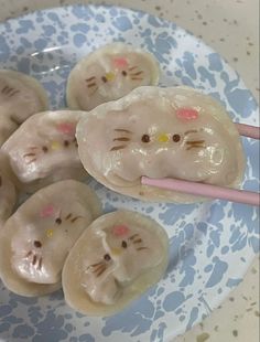 a plate with some food on it and chopsticks in front of the plates