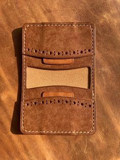 Unveil the artistry of our handcrafted leather wallet, a true gem fashioned from the exquisite Badalassi Carlo Italian leather of the Pueblo line. Beyond its practicality in holding 8-10 plastic cards and bills, this wallet is a testament to enduring style. The Pueblo leather's captivating patina ensures each piece is a unique expression of luxury. Elevate your daily essentials with a touch of Italian craftsmanship - a wallet designed not just for today, but for the stories it will carry with you into the future. Handcrafted Leather Wallet, Just For Today, Italian Craftsmanship, Plastic Card, Clip Wallet, Money Clip Wallet, Bifold Wallet, Daily Essentials, Handcrafted Leather