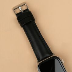 Enhance your Apple Watch experience with the Leathere Premium Leather Apple Watch Band. Designed with meticulous attention to detail, this strap combines timeless elegance with modern functionality, making it perfect for both casual and formal occasions.  Main Features:  Luxury Leather Sophisticated Design Secure Fit Compatible with All Apple Watch Models Adjustable Length Can be personalized %100 Leather Apple Watch Black, Leather Apple Watch Band, Cuff Watch, August Birthstone Jewelry, Apple Watch Bands Leather, July Birthstone Jewelry, Apple Watch Models, Jewelry Ring Box, Pearl Jewellery Earrings