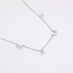 The necklace featuring the endearing message "Mama." Versatile and timeless, this classic piece effortlessly complements any look. The delicate chain adds a touch of charm, while the "Mama" lettering beautifully expresses your love. Minimalist Name Necklace Gift For Mom, Sterling Silver Initial Pendant Name Necklace With Clavicle Chain, Mother's Day Sterling Silver Initial Necklace With Clavicle Chain, Mother's Day Sterling Silver Initial Necklace With Delicate Chain, Sterling Silver Clavicle Chain Initial Necklace For Mother's Day, Minimalist Initial Necklace For Mom, Mother's Day Sterling Silver Name Necklace With Delicate Chain, Name Necklace With Delicate Chain As Gift For Mom, Classic Silver Name Necklace With Delicate Chain