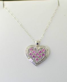 925 Sterling Silver Pink Sapphire Diamond Heart Necklace .03 ct Check out www.Jewelryland.com for a great selection of high quality jewelry at extremely reasonable prices. Please feel free to re-pin, comment or like any of our jewelry. 925 Stamped Heart Pendant Necklace For Valentine's Day, Silver Heart Pendant Necklace For Valentine's Day, Valentine's Day 925 Stamped Heart Pendant Necklace, Valentine's Day 925 Stamped Heart Necklace, Valentine's Day Heart Necklace Stamped 925, Teardrop Diamond Necklace, Diamond Heart Necklace, Diamond Heart Pendant Necklace, Open Heart Necklace