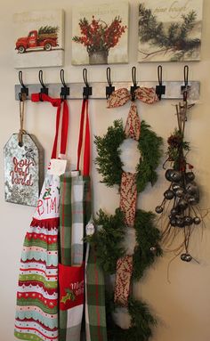 christmas stockings hanging from hooks on a wall