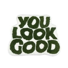 the words you look good are made out of fake grass on a white background with black lettering