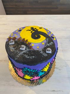 there is a decorated halloween cupcake on top of the table with sprinkles