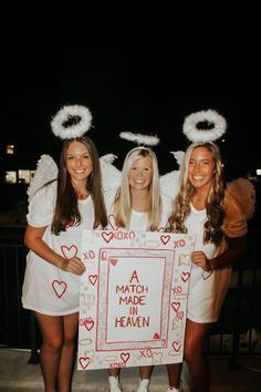 three girls dressed up as angels holding a sign that says, a match made heaven