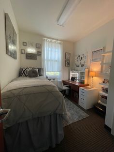 the bedroom is clean and ready to be used as a home office or study area