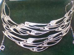 "A rare vintage Scottish sterling silver \"flight of swallows\" collar necklace inspired by Peter Wylie Davidson. This is a fantastic piece of collectable jewellery that is very sort after and will only increase in value. perfect condition with original box. Fully hallmarked for Edinburgh, CA, 1977. The necklace is very wide measureing 5.1cm across the widest point and sits beautifully on the collar bones. the chains either size of the swallows are a total of 24cm + 14cm measureing across the top of the swallows. Please ask if you wish to see pics of the measurements!" Fine Chain Necklace, Spoon Necklace, Vintage Jewellery Rings, Soldering Jewelry, Collar Jewelry, Choker Necklaces, Jewelry Business, Jewelry Inspo, Collar Necklace