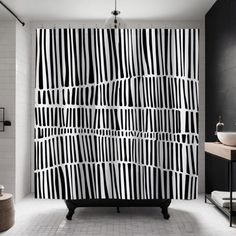 a black and white shower curtain in a bathroom