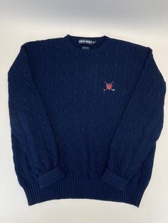 Details  Embroidered Golf Shield Logo Cable Knit Color: Navy 100% Cotton Winter Golf Tops With Long Sleeves, Casual Winter Golf Tops, Navy Long Sleeve Sweater With Embroidered Logo, Mens Cable Knit Sweater, Mens Outdoor Fashion, Pullover Sweater Men, Shield Logo, Vintage Polo Ralph Lauren, Polo Ralph Lauren Mens