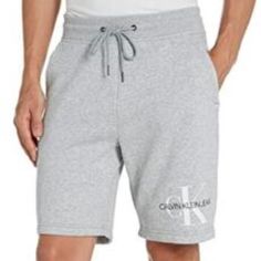 Minimalist Shorts With Logo Lettering On The Knee And Drawstring Waist For A Secured Fit. Elasticized Drawstring Waistband Pull-On Style Side Slip Pockets Logo Detail Cotton/Polyester Machine Wash Imported 72% Cotton, 28% Polyester Imported Drawstring Closure Machine Wash Monogram Logo Design Extra Soft Cotton Blend For Breathable Comfort Lounge And Street Style Drawstring Closure Front Slip Pockets Size & Fit Rise, About 12" Inseam, About 9" Leg Opening, About 20" Sporty Calvin Klein Cotton Bottoms, Calvin Klein Cotton Shorts For Loungewear, Calvin Klein Casual Sport Bottoms, White Swim Trunks, Sweat Shorts Men, Mens Monogram, Calvin Klein Swimwear, Casual Summer Pants, Calvin Klein Shorts